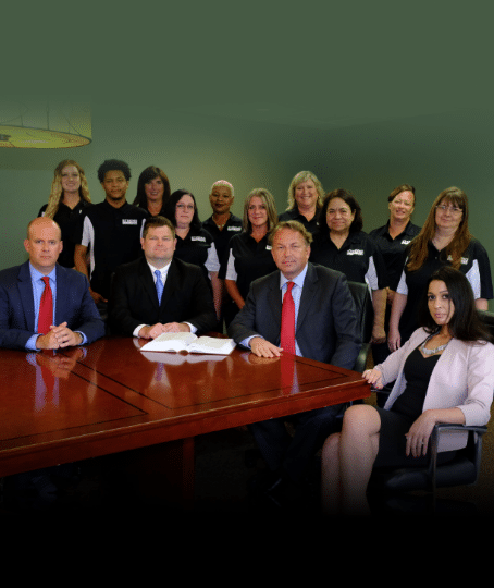 Strong Law office lawyers wearing suits and their members or employees wearing their company shirts