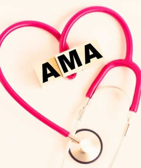 a heart made out of a stethoscope and wooden cubes with letters AMA American Medical Association