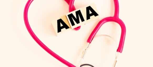 a heart made out of a stethoscope and wooden cubes with letters AMA American Medical Association