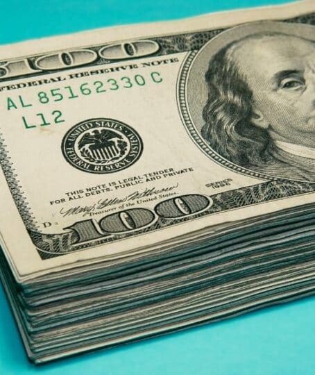 Cash. Money. US dollars. 100 dollar bills. one hundred dollar bills. paid.