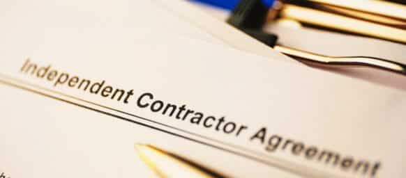 Legal document Independent Contractor Agreement on paper close up