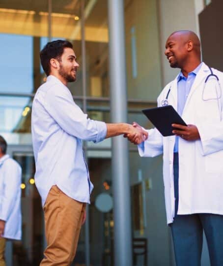 Doctor and patient shaking hands