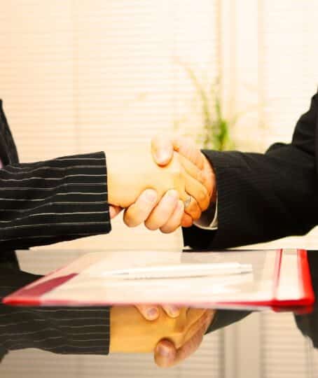 Lawyer and client are handshaking after successful meeting