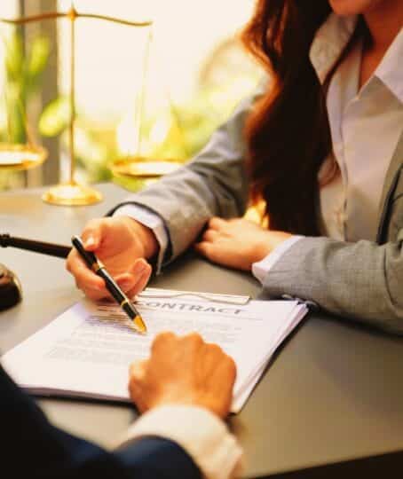 business people and lawyers discussing contract papers sitting at the table. Concepts of law, advice, legal services. in morning light