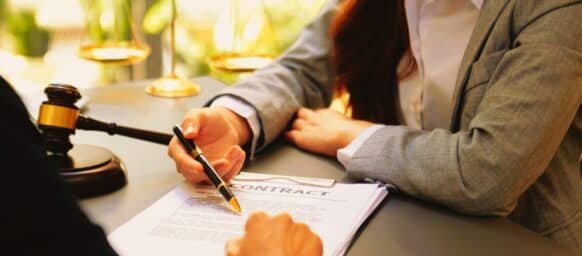 business people and lawyers discussing contract papers sitting at the table. Concepts of law, advice, legal services. in morning light