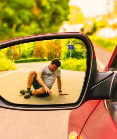 Rearview mirror with a man hit by a car