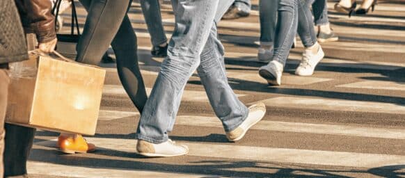 pedestrians walking on a pedestrian on a sunny day