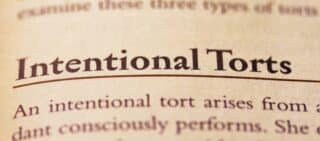 intentional tort printed in text on page as visual aid or business law reference exceptions to the exclusive remedy rule