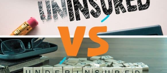 Making uninsured in to insured by eraser. underinsured word or concept represented by wooden letter tiles on a wooden table with glasses and a book