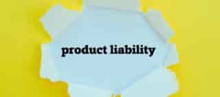 PRODUCT LIABILITY word written under torn paper.