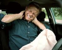 Male Motorist With Whiplash Injury In Car Crash With Airbag Deployed