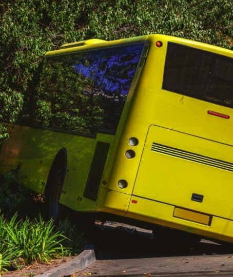 The bus flew off the road and crashed into a tree