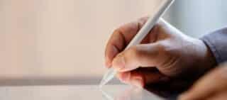 man signing a workers' comp lump sum settlement agreement digitally