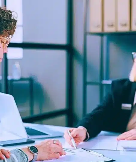 Young woman with neck injury filling documents. What if a third party is responsible for my workplace injury.