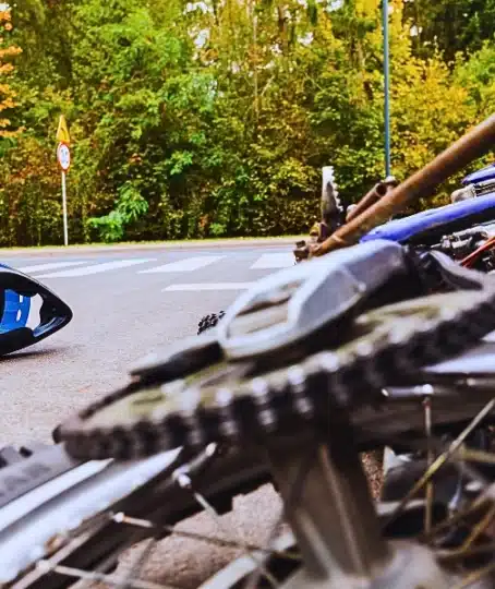 Close-up of the bike and the car on the street. Motorcycle Accidents and Helmet Laws