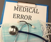 "MEDICAL ERROR" text on clipboard with stethoscope and masks.